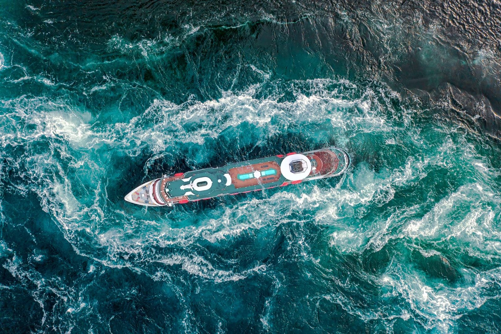 Ship sailing through turquoise waters